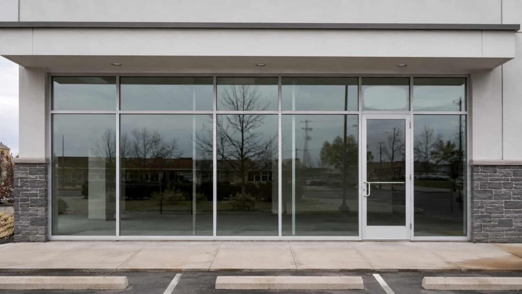 Aluminum-framed commercial storefront with large clear glass panels